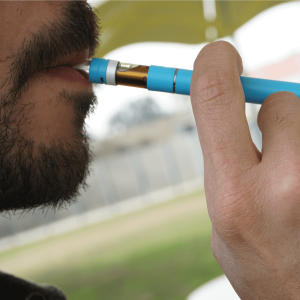 Person inhaling a cannabis cartridge
