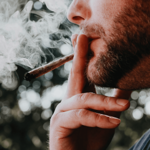 A man smoking a joint