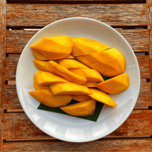 A plate of cut ripe mango