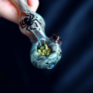 Cannabis buds in a glass pipe 