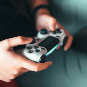 A person holding a game controller