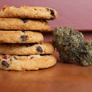 cannabis nugs pictured next to a stack of cookies
