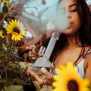a woman smoking a bong