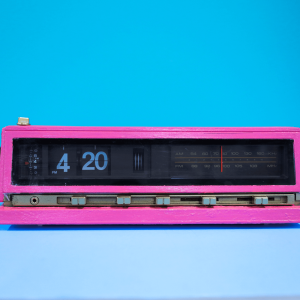 A pink clock showing 4:20pm