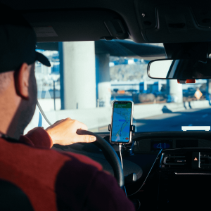 A delivery driver using a navigation system