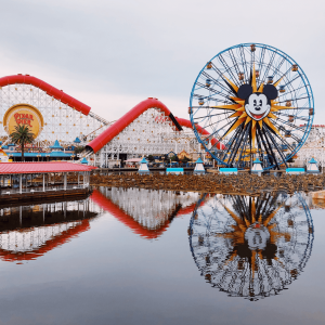 Disneyland’s Pixar Pier featuring a blue ferris wheel and rollercoaster rides