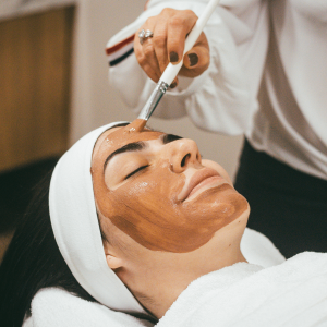 woman wearing mud mask at a spa