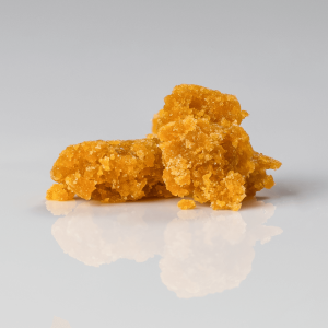 Bright gold crumble sitting on a white surface