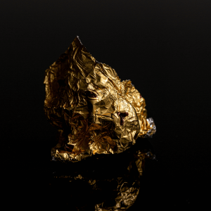 Gold tinfoil crumpled in a ball