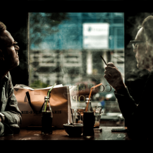 Two men smoking weed at an Amsterdam coffee shop