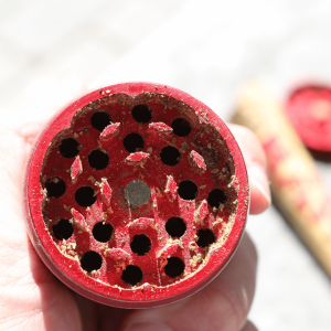 Cannabis flower in a grinder