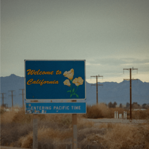 A sign alongside a highway that says ‘welcome to california’