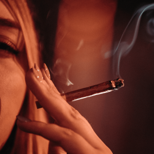 A woman smoking a blunt