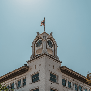 a tall building with a flag in Santa Ana, CA