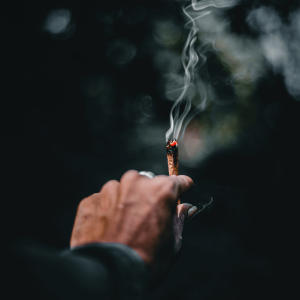 a person burning a joint