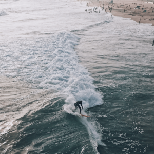 a person surfing in huntington beach
