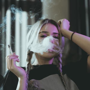 a girl smoking a joint