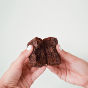 a person breaking open a THC brownie 