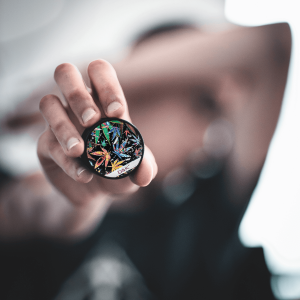 a person holding a grinder