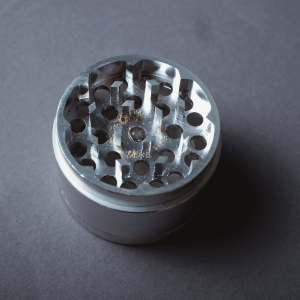 a silver metal cannabis grinder