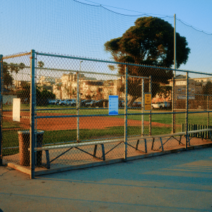 a baseball field behind a fence