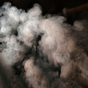 a cloud of smoke against a black background