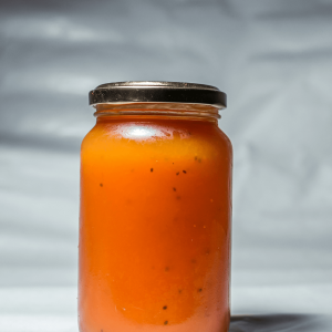 orange jam in a glass jar