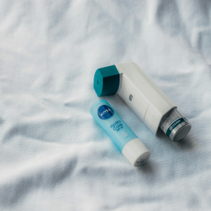 a THC inhaler pictured next to a lip balm