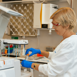 a woman in a lab using hospital testing equipment
