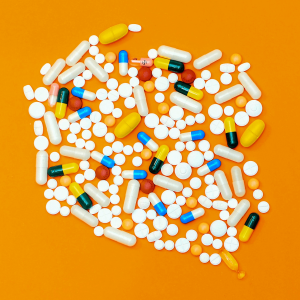 white and orange medication pills
