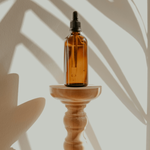 black and amber bottle on white wooden table