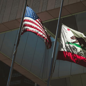 california flag waving next to an American flag