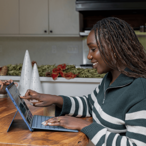 woman at kitchen counter on her laptop