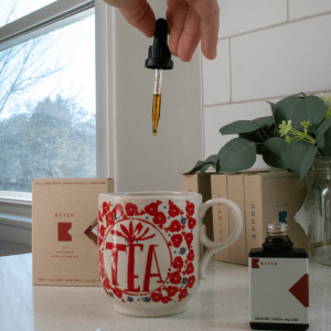 cannabis tincture added to tea cup