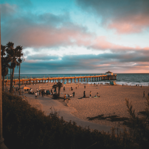 people on the sand in manhattan beach