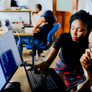 two people looking at a computer