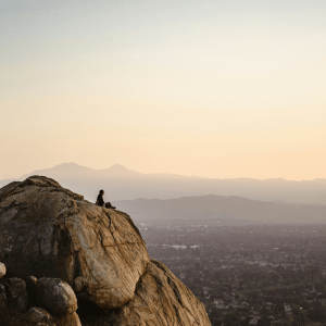 woman on a rock overlooking the valley