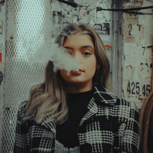 woman in black and white smoking weed