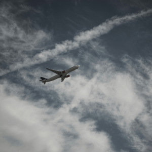 a plane flying through gray skies