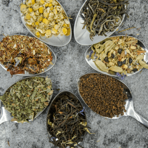 various spoons containing tea leaves