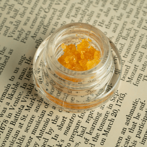 gold cannabis wax in a glass jar