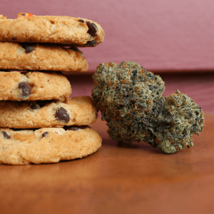 a stack of cookies pictured next to cannabis flower