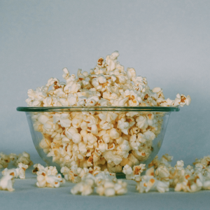 overflowing glass bowl of popcorn