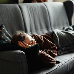 person on the couch watching a movie