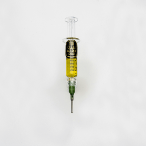 gold cannabis oil in a syringe