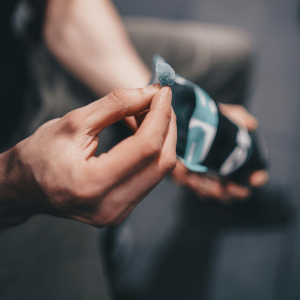 a person holding a blue gummy