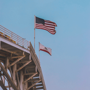 american and california flags waving