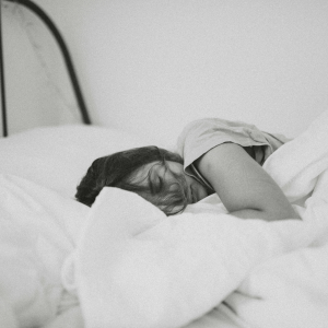 grayscale image of girl sleeping