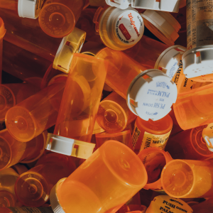 a pile of prescription pill bottles