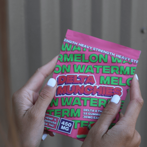 person holding cannabis edibles package